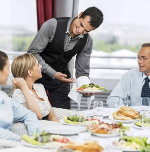 waiter servicing food in a restaurant